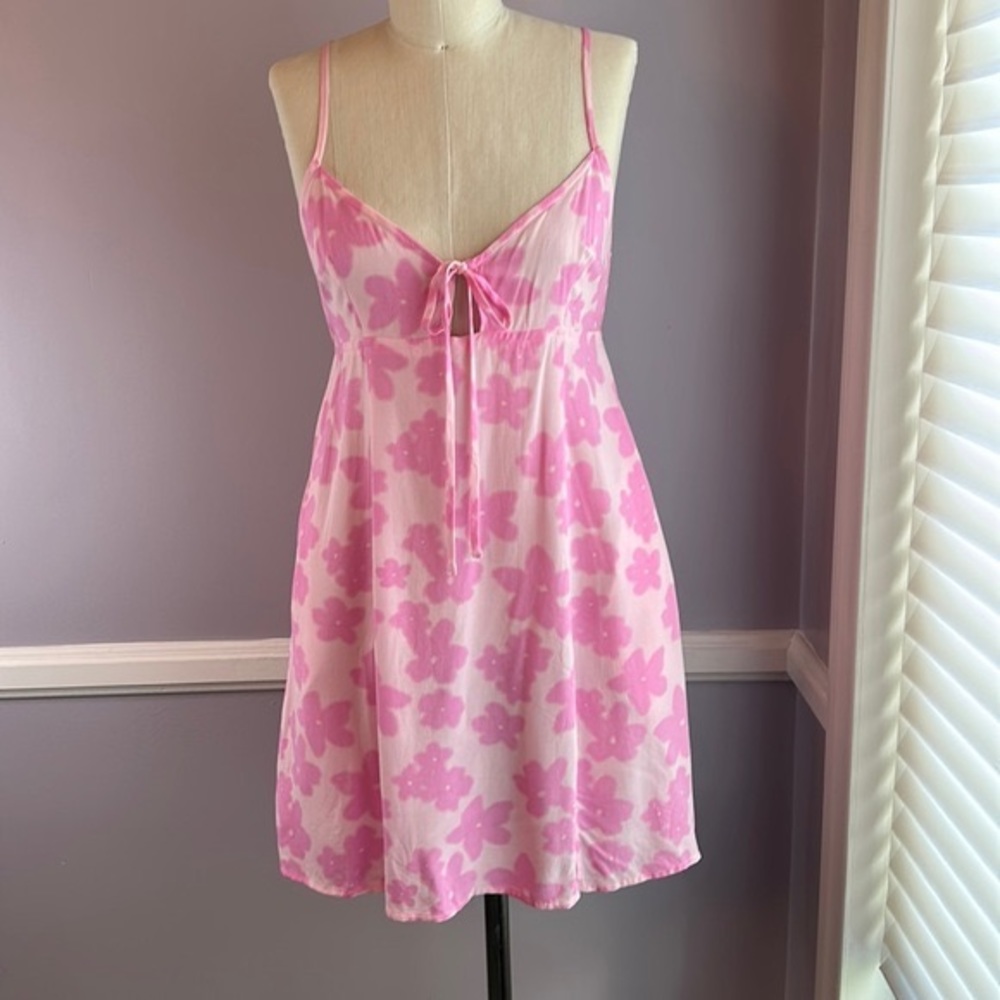 Pink floral lightweight mini sundress with side pockets and adjustable straps